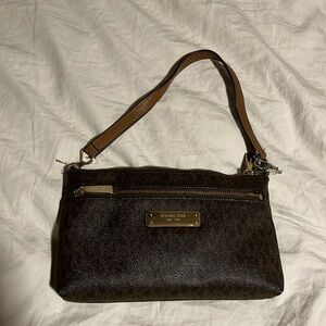 Michael kors wristlet could be used as a small cosmetic bag.